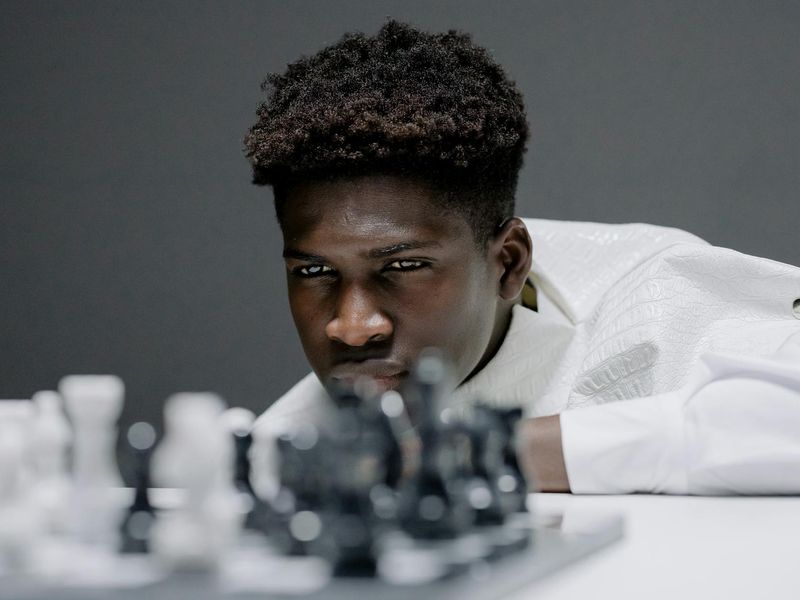 Close up of a man face showing deep concentration during exercise.